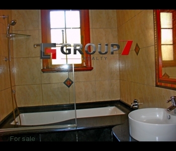 En-suite bathroom with shower and tub.