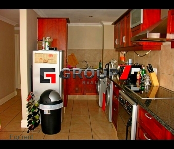 Fully fitted kitchen with tumble dryer and washing machine