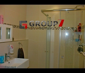 Bathroom with shower cubicle and fully tiled