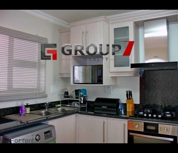 Kitchen with gas stove and stainless steel extractor